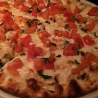 Spinach Ricotta Pizza · White cream sauce, mozzarella, spinach, and ricotta. That's a freaking good pizza.