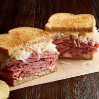 Reuben The Great With Pastrami Regular · 1/2 pound of hot pastrami, Swiss, sauerkraut, 1000 Island dressing, on toasted rye. Served w...