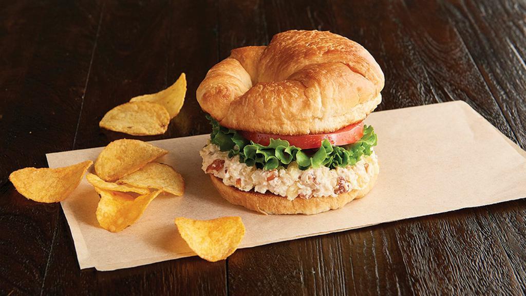 Chicken Salad Sandwich Regular · With Almonds & Pineapple! Name your bread, select your spreads and dress it up. Also served with chips or baked chips (150/100 cal) and a pickle (5 cal).