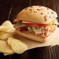 Smoked Turkey Breast Sandwich Regular · Delectable, nitrite-free smoked turkey, sliced fresh daily. Name your bread, select your spr...