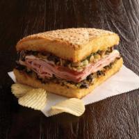 Quarter Muffaletta Special · Choose a ham & salami or a turkey muffaletta. Served with chips or baked chips and a cup of ...