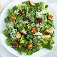 Caesar Salad · Romaine lettuce, Parmesan cheese, and croutons.