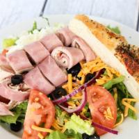 Chef Salad · Romaine lettuce, turkey, ham, tomatoes, shredded mozzarella, cheddar cheese, black olives an...