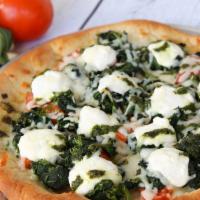 Spinaci · Spinach, pesto, and ricotta cheese topped with fresh tomatoes.