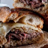 The French Dip · slow-roasted beef, Swiss, caramelized onions, toasted garlic roll, side of au jus, and horse...