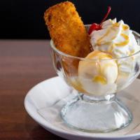 Crunchy Fried Cheesecake · Warm fried cheesecake, vanilla ice cream, Ghirardelli caramel sauce, whipped cream and a che...
