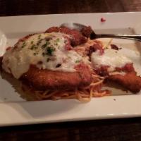 Chicken Parmigiano · Breaded then baked in marinara and topped with melted house-made mozzarella.