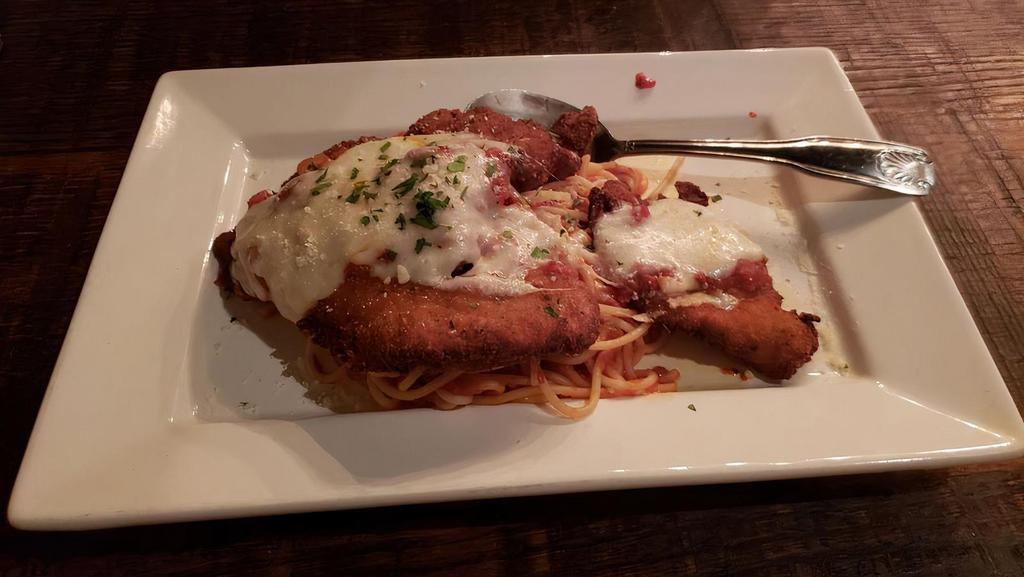 Chicken Parmigiano · Breaded then baked in marinara and topped with melted house-made mozzarella.