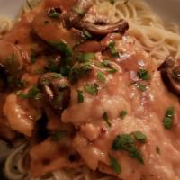 Chicken Marsala · Sauteed in a marsala wine reduction with demi glace and mushrooms over capellini.