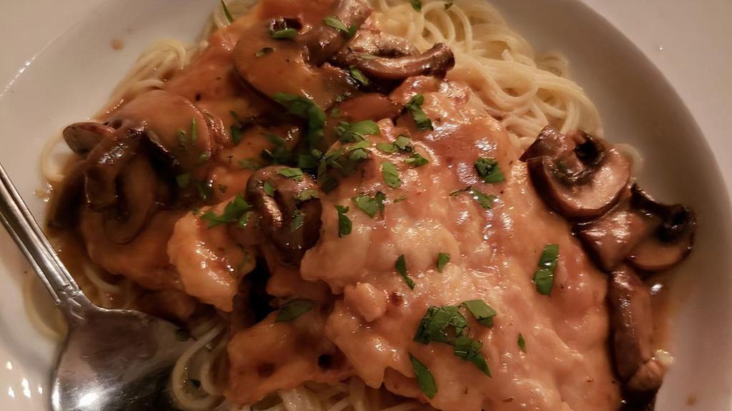 Chicken Marsala · Sauteed in a marsala wine reduction with demi glace and mushrooms over capellini.