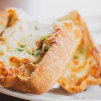 Cheesy Garlic Bread · Melted mozzarella, homemade marinara