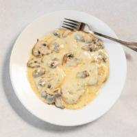 Wild Mushroom Ravioli · Creamy parmesan sauce, truffle oil