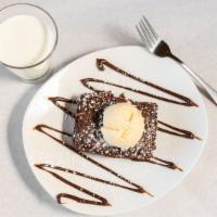Triple Chocolate Brownie · Warm double fudge brownie, vanilla bean ice cream, chocolate sauce