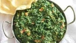 Saag Paneer · Chopped spinach prepared in a delightfully light cream sauce with cubed ‘Paneer’ (cheese).