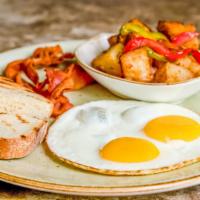 The Local Breakfast · Two eggs any style, bacon or sausage, white or wheat toast, and home fries.