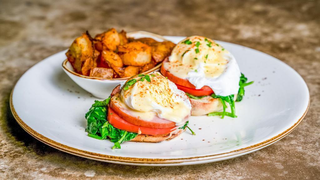 Classic Benedict · Canadian bacon, tomatoes, spinach, and home fries.