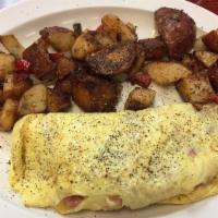 Plain Omelette · Three egg omelette served with choice of home style potatoes, hashbrown or grits and toast.