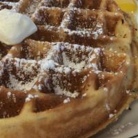 Belgian Waffle · Golden Belgian waffle, powdered sugar and maple syrup.