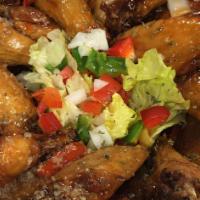 Crispy Chicken Wings & Fries · Chicken wings cooked to crispy perfection tossed in your choice of our savory sauces mild, m...