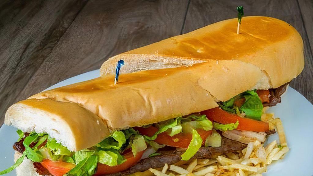 Pan Con Bistec / Bread With Steak · Con cebolla, tomate, lechuga y mayonesa en pan Cubano. Papas fritas / With onion, tomato, lettuce and mayonnaise on Cuban bread. French fries included