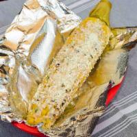 Street Corn (Elote) · Fresh grilled corn on the cob, topped with our special sauce, and cotija cheese.