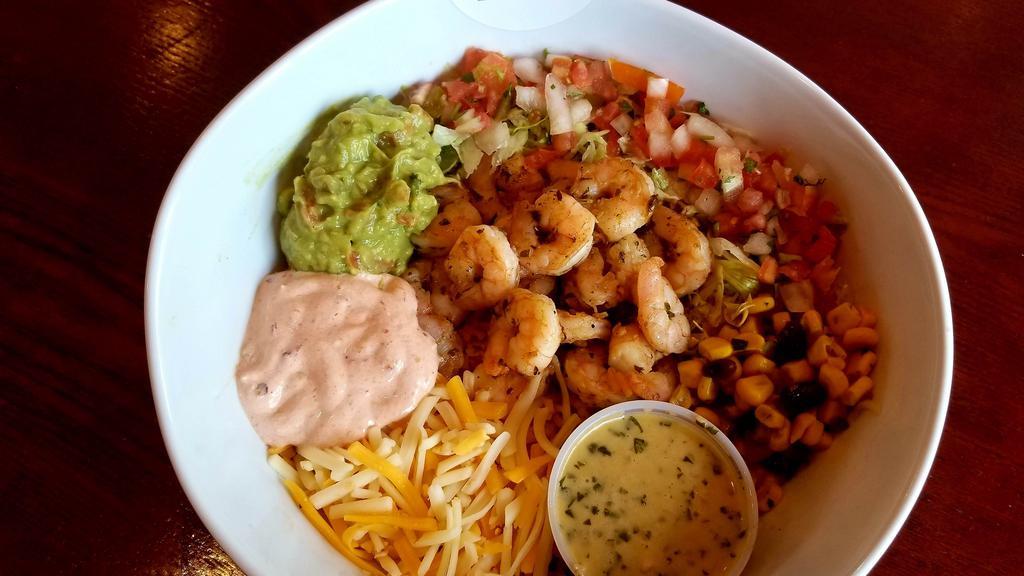 Tacomoli Bowl · Rice, lettuce, pico de gallo, guacamole, chipotle crema, corn salsa, cheese, and our house chimichurri.