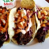 Skirt Steak Chimichurri Tacos (3) · 3 tacos served on corn tortillas, with red cabbage, pico de gallo, and chipotle crema. With ...