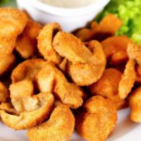 Fried Mushrooms · Fresh mushrooms battered in flour and fried into golden-crunchy fried mushrooms.