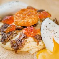Divine Bowl · Sausage, fried goat cheese, pepper jelly, poached egg, Cheddar grits or Homefries