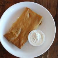 Spinach Pie (Spanakopita) Appetizer · Flaky phyllo dough stuffed with a mixture of spinach and feta cheese. Served with tzatziki s...