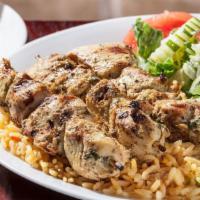 Chicken Skewers (Souvlaki) Dinner · Three char-grilled chicken skewers over rice with a Greek salad. Served with pita bread.