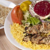 Chicken Skewers (Souvlaki) Light Meal · Two char-grilled chicken skewers over rice with a Greek salad. Served with pita bread.