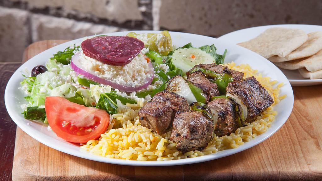 Steak Skewers · Souvlaki. Two char-grilled steak skewers over rice with a greek salad. 1137 cal.