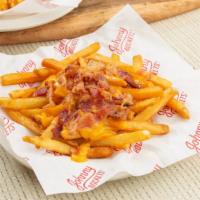 Bacon Cheese Fries · Crispy skin-on french-fried potatoes topped with creamy real-cheddar cheese sauce shredded w...