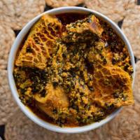 Egusi Soup · Ground egusi (lemon seed) soup, cooked with fish base. Served with pounded yam, plantain fuf...