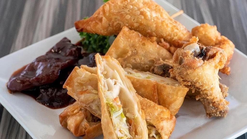 Chai Sampler · Includes 2 Egg Rolls, 2 Wings, 2 Beef Sticks, 2 Curry Triangles & 2 Poppers