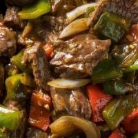 Pepper Steak · Sauteed with onions & bell peppers in a rich brown sauce