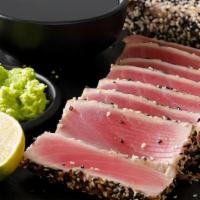 Tataki · Choice of seared Tuna, Wahoo or Salmon served with scallions, sesame seeds & ponzu