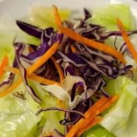 House Salad · Green salad with ginger dressing.