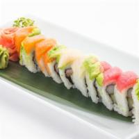 Rainbow Roll · Krab,avocado,cucumber with tuna and salmon on top.