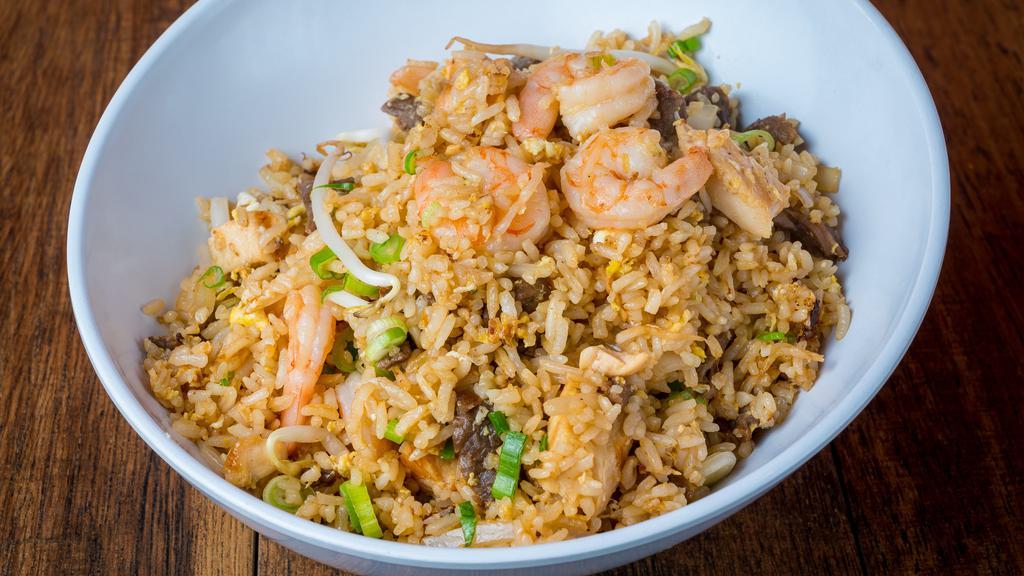 Special Fried Rice · Made with  Chicken,Beef and Shrimp ,sesame oil ,Scallions,Onions,Bean Sprouts and Eggs with our Special Sauce.