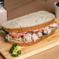 Tuna Sandwich · Whole Grain Bread, Wild catch Tuna, Green Mix, Homemade Mayo, Onion and Tomato.