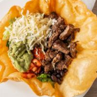 Taco Salad · Crispy tortilla bowl, ground beef, black beans, Mexican three cheese blend, salsa, and guaca...