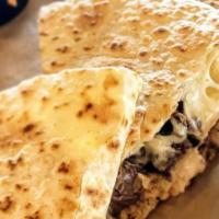 Traditional · Grilled flour tortilla stuffed with our Mexican three cheese blend.
