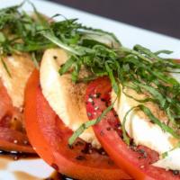 Tomato Caprese · Sliced beefsteak tomatoes, fresh milk mozzarella, fresh basil balsamic vinegar, extra virgin...
