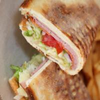 Italian · Salami, ham, pepperoni, shredded lettuce, Roma tomatoes, red onions, melted house cheese ble...
