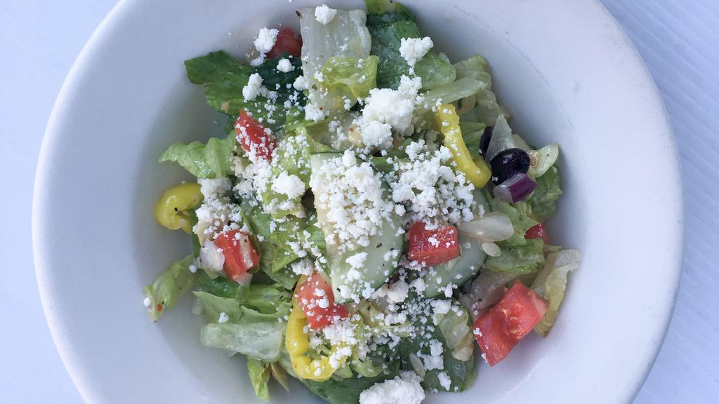 Greek Salad · Romaine, Roma tomatoes, red onions, cucumbers, kalamata olives artichoke hearts, banana peppers, feta, greek vinaigrette dressing.