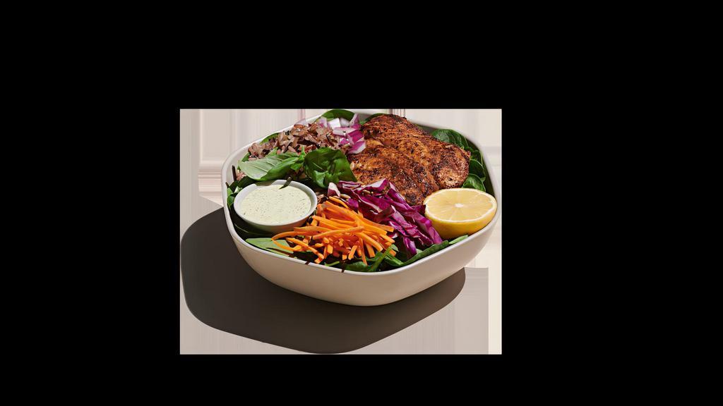 Blackened Catfish Bowl · blackened catfish, shredded cabbage, raw carrots, red onion, basil, sunflower seeds, warm wild rice, baby spinach, fresh lemon squeeze, green goddess ranch