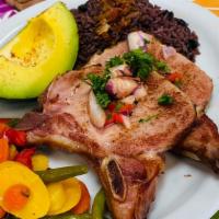 Chuleta Ahumada · Viene  con dos (2) acompañantes y opción de Arroz. | Smoked Pork Chop. Comes with your choic...