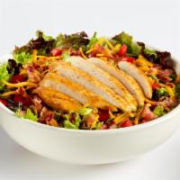 Grilled Chicken Club Salad · Grilled chicken breast served on seasonal greens with chopped Applewood smoked bacon, diced ...